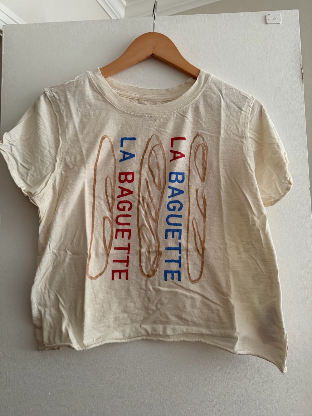Anthropologie Cream Graphic 'La Baguette' Tee with Red & Blue Text